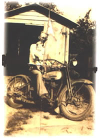 Grandpa Ruddock and Uncle Wayne on a motorcycle in 1932