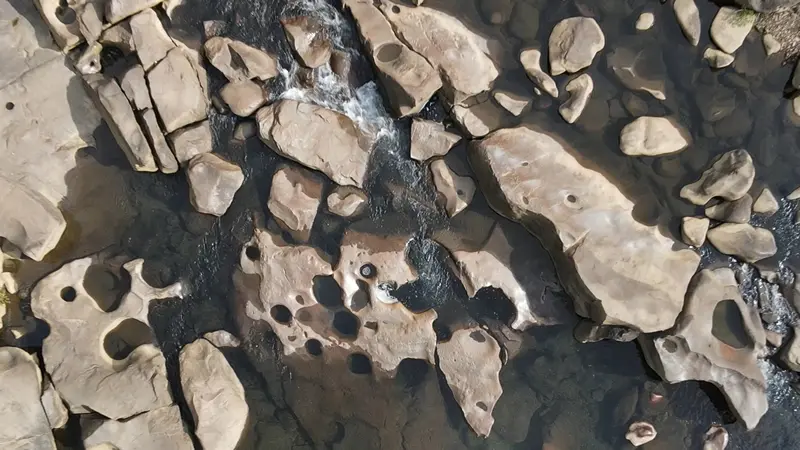 Overview of Blue Hole at low water; you can see the potholes and caves from above