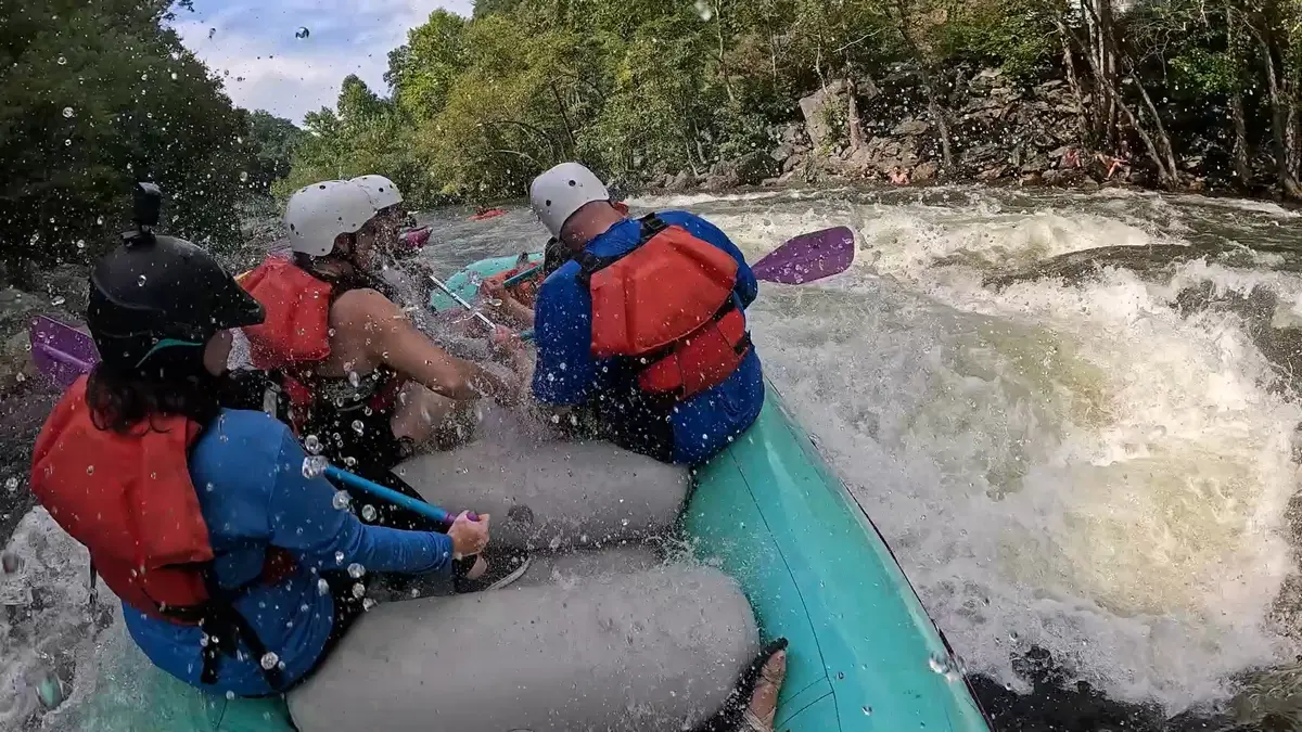 Raft navigating the broken ledges to a big splash at the bottom of Cat's Pajamas Rapid