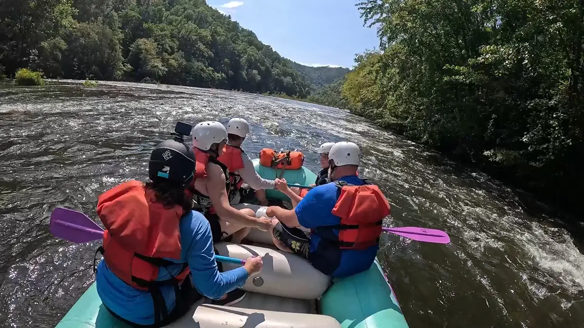 Raft navigating the lazy Hiawassee Shoals rapid