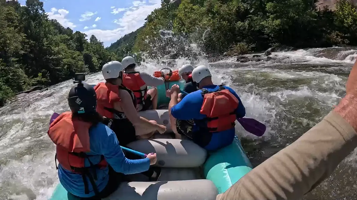 Fast Fred's Ocoee Watersports Raft Splashing through Waves at North Shore Rapid