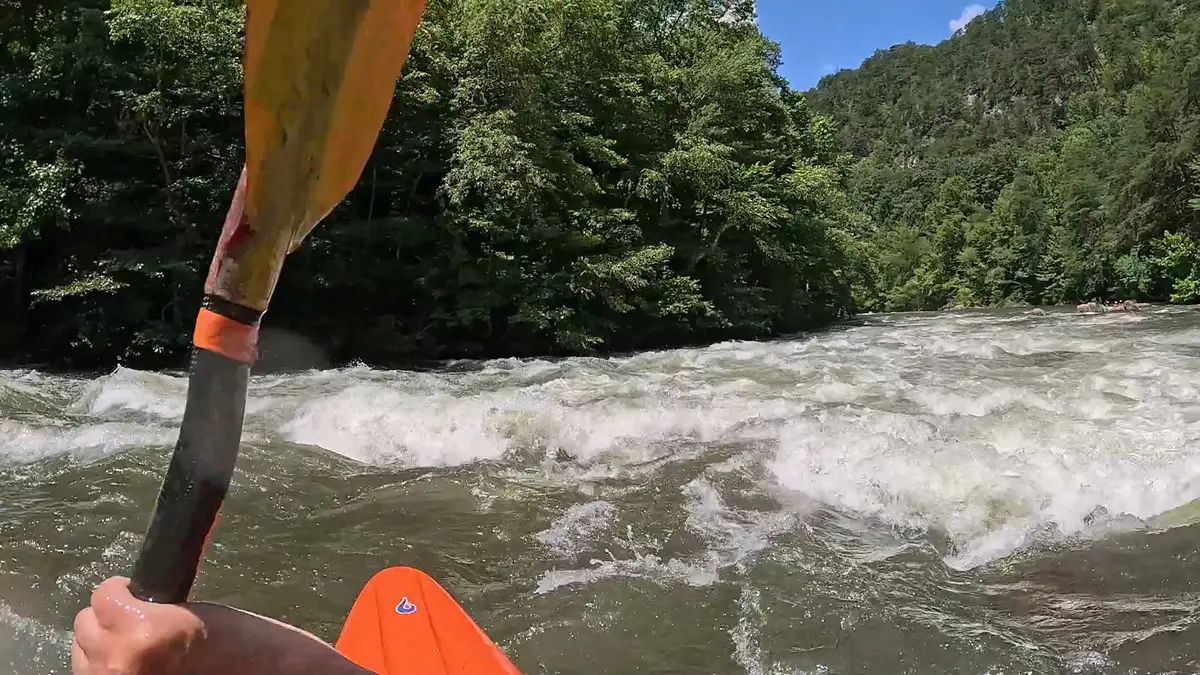 Fast Fred aiming his kayak at the tongue of Second Helping ledge