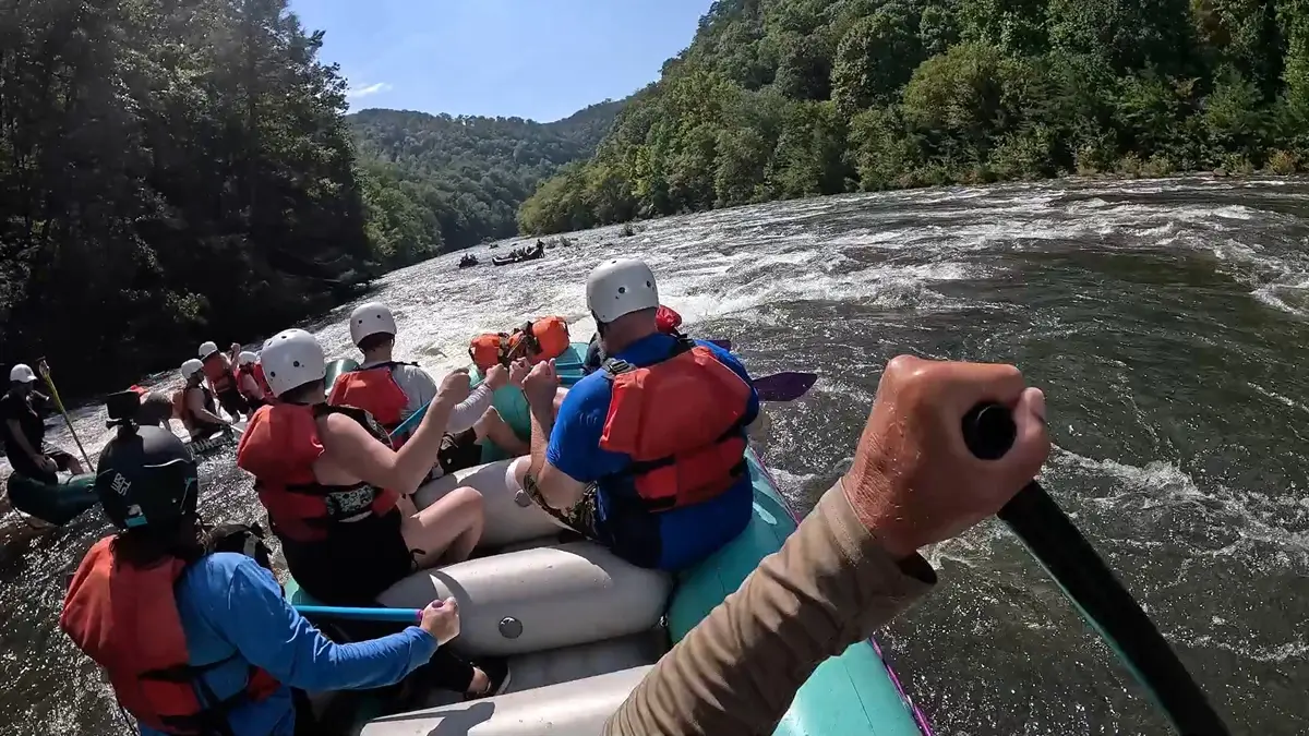 One raft pinned and another raft navigating the technical drops at The Ledges