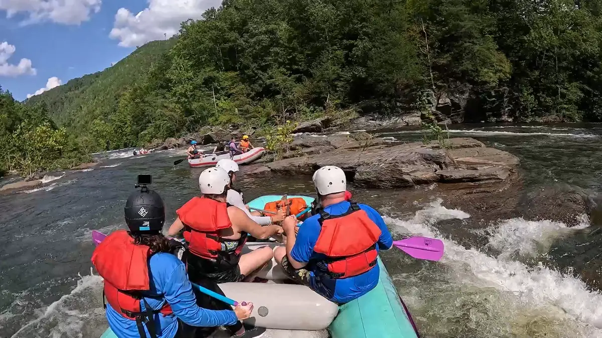 Raft taking a side trip to surf above Western Flyer Rapid
