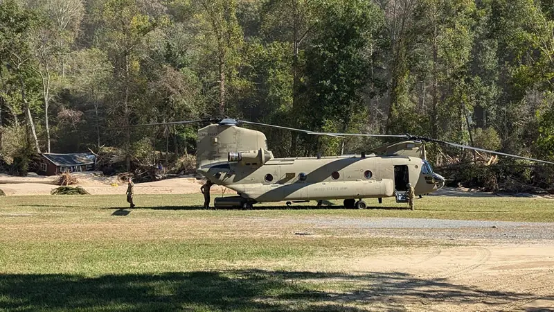 82nd Airborne Chinook helicopter delivering supplies to Green River Cove after Hurricane Helene