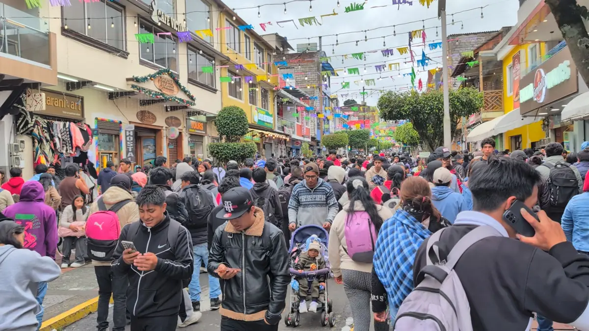Massive crowds of pilgrims participating in the Caminata de la Fe pilgrimage towards Baños, Ecuador