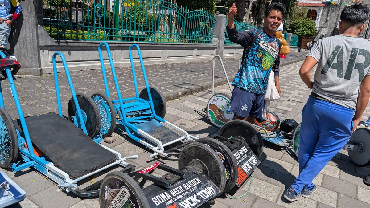 Traditional Carrera de Coches de Madera race passing by Soma Brewing in Baños, Ecuador