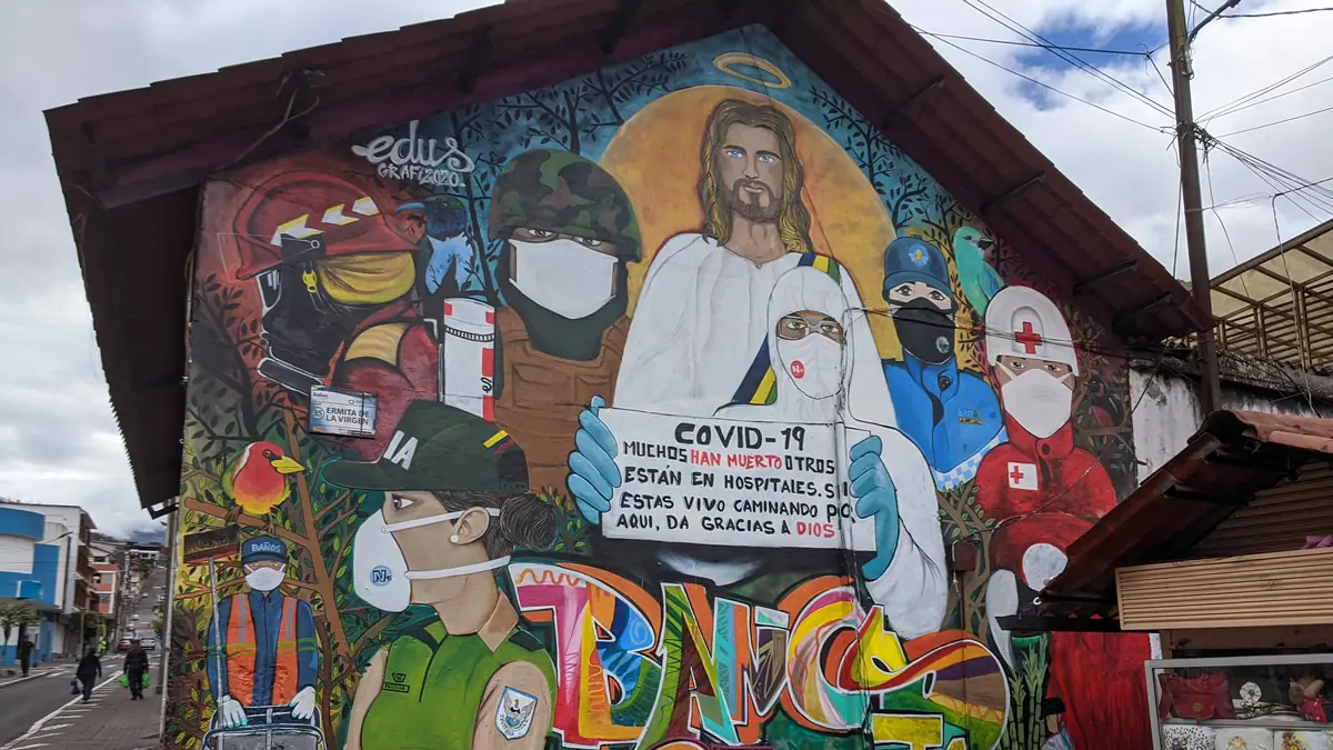 Street art in Baños de Agua Santa Ecuador depicting Jesus and first responders with regards to COVID during 2020.