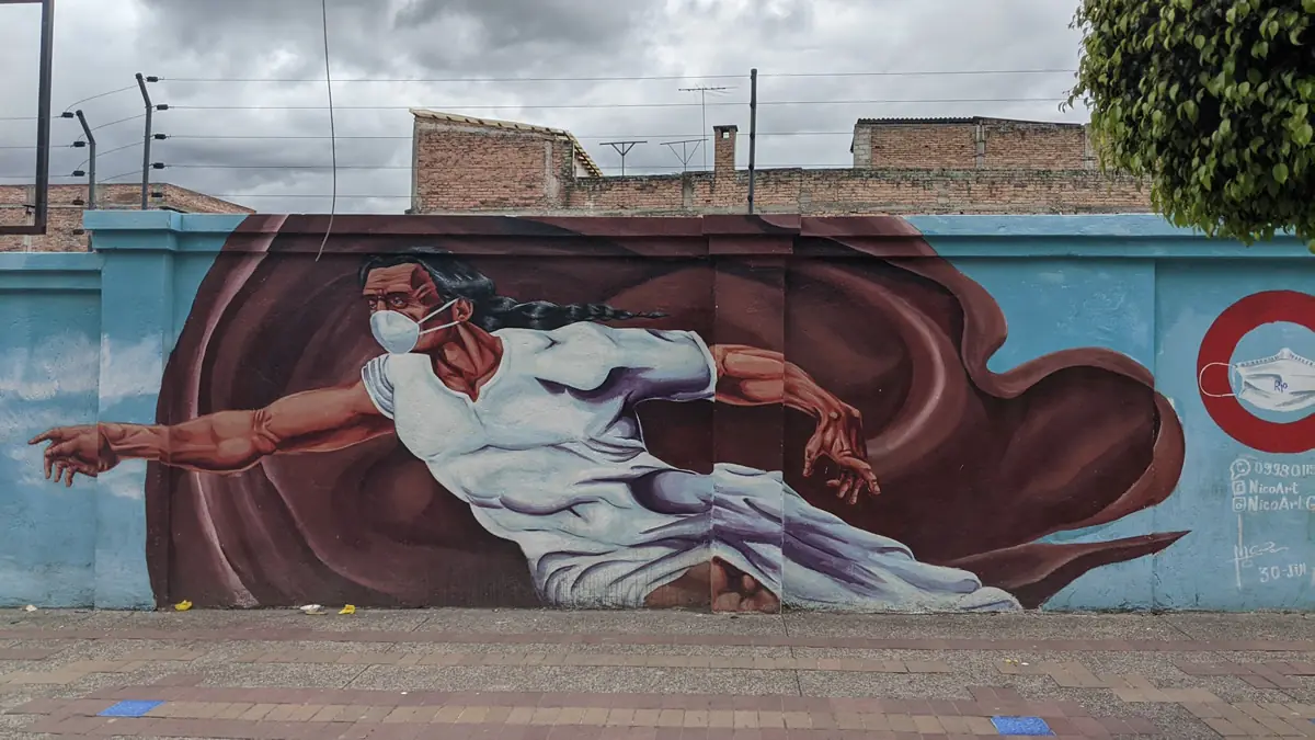 God depicted in Otavalo wearing a mask and passing the spark of life.