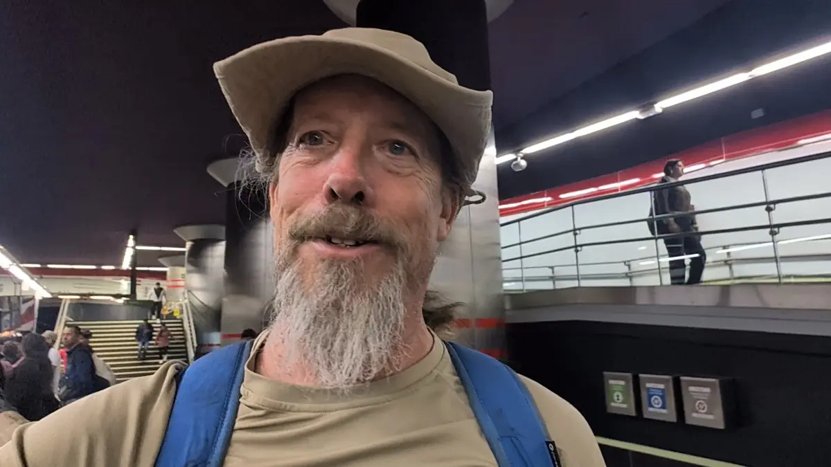 Fast Fred taking a selfie inside the modern Quito Metro station