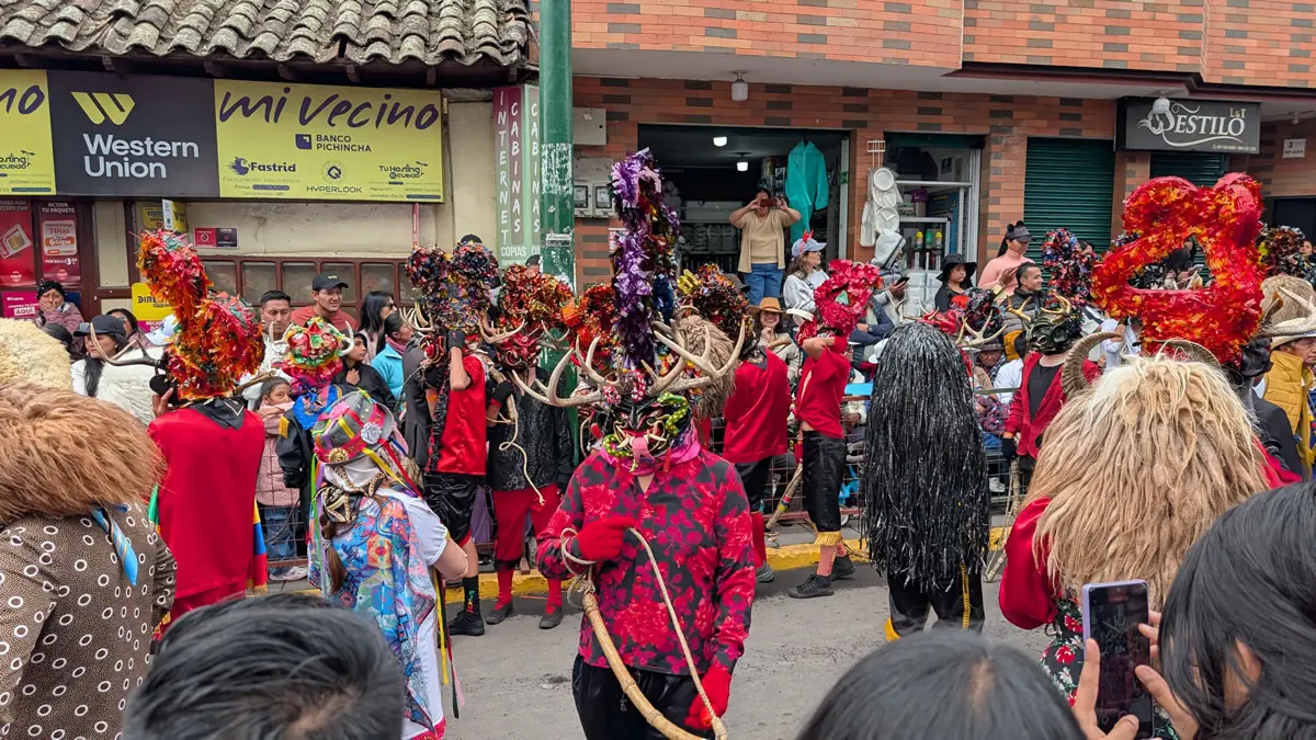 Diablada Pillareña dancers symbolizing cultural resistance through elaborate masks and performance in Píllaro, Ecuador