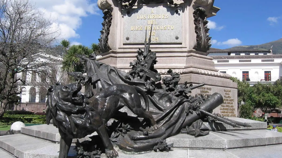 Base of the Monument to the Heroes of the 10th of August featuring a bronze lion in Plaza Grande, Quito, Ecuador