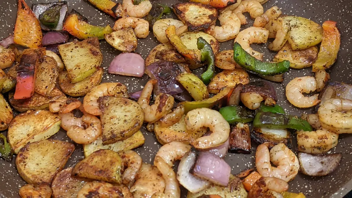 A fresh shrimp and vegetable dish from Guatemala, showcasing healthy, local-economy dining options for frugal travelers.