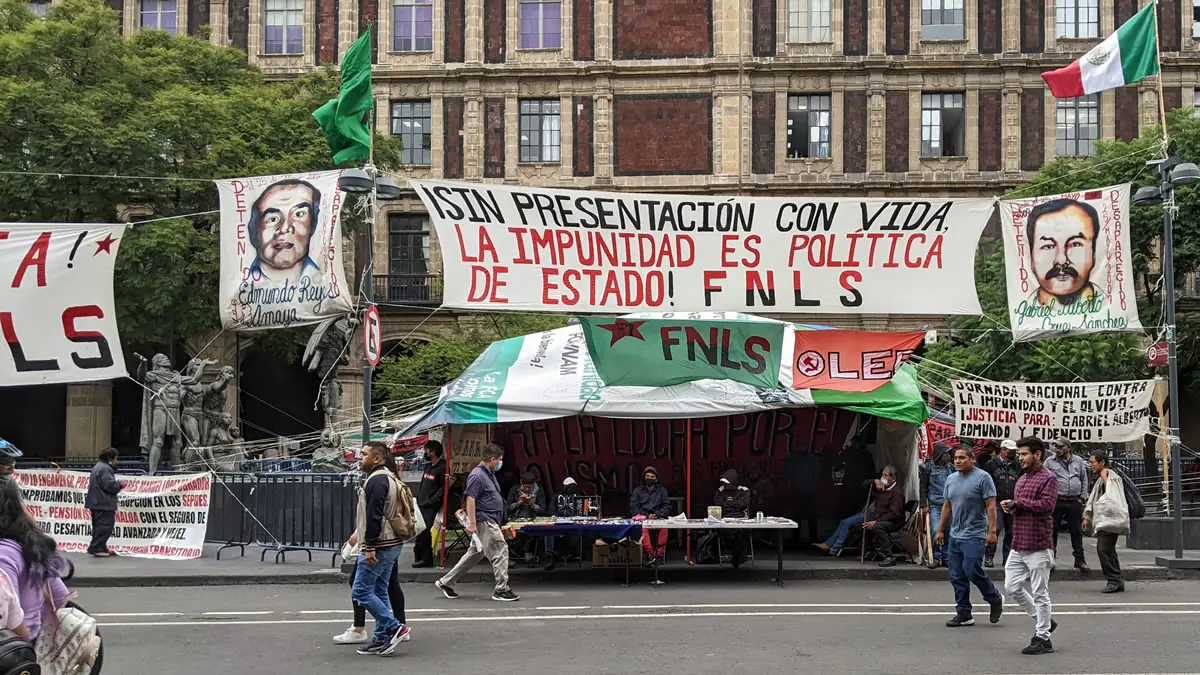 Wide view of the Zocalo in Mexico City with FNLS protest banners