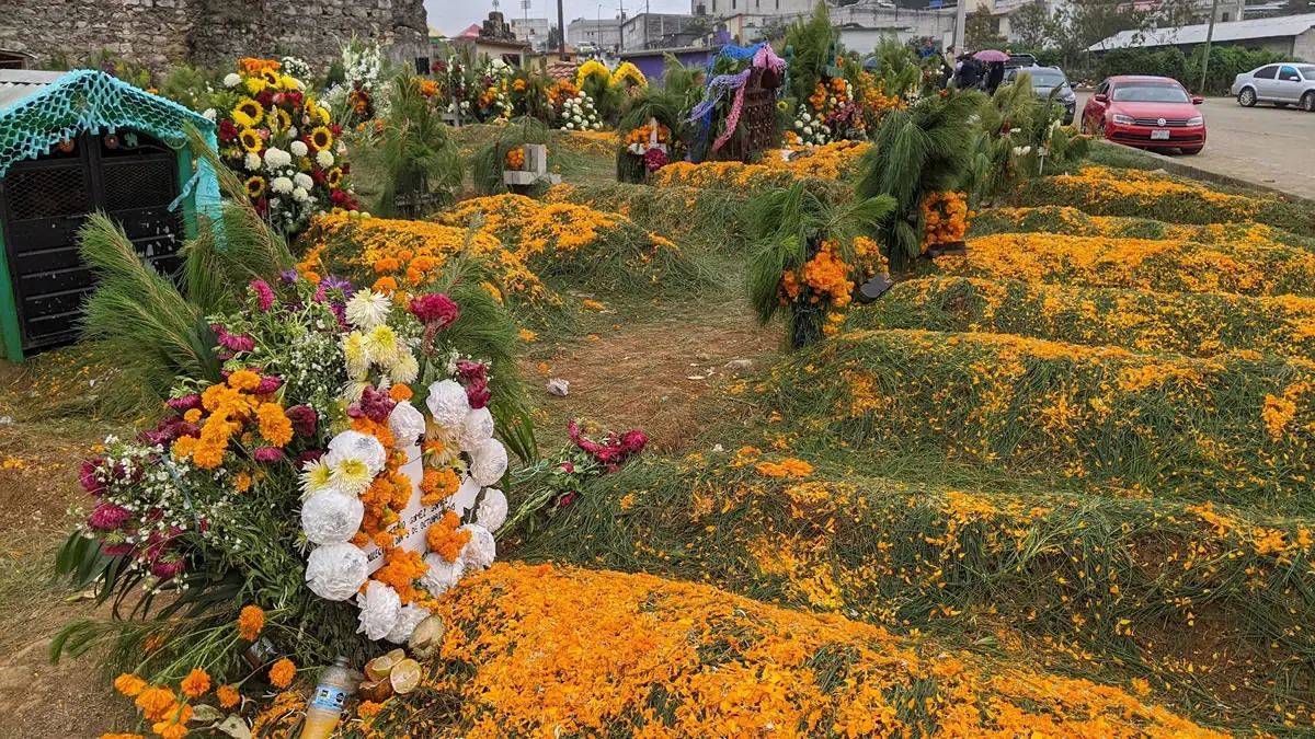 Traditional Day of the Dead (Día de los Muertos) celebrations in Chiapas, Mexico, featuring vibrant altars and marigold decorations.