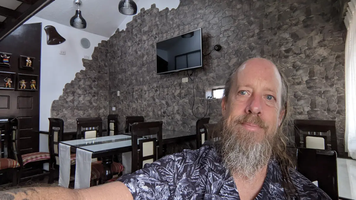 The cozy dining area of a local bed and breakfast in Cusco, Peru, offering a cozy and authentic environment for travelers.