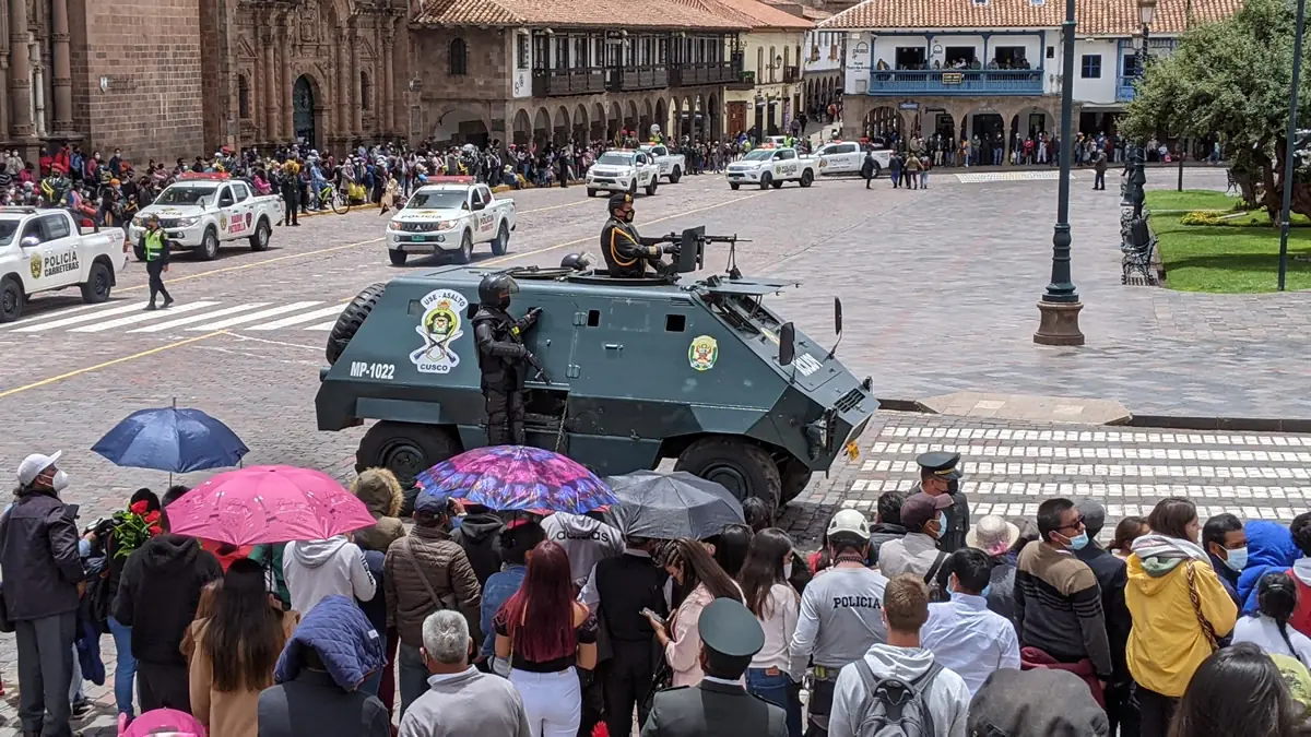 Cusco police armored vehicle with machine gun at police parade.