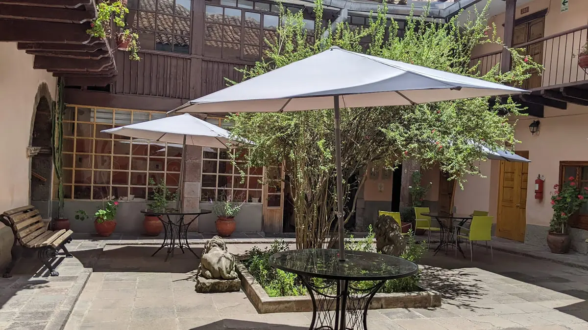 The view from the dining room looking back toward the frugal interior rooms at Hostal Qorichaska in Cusco, Peru.