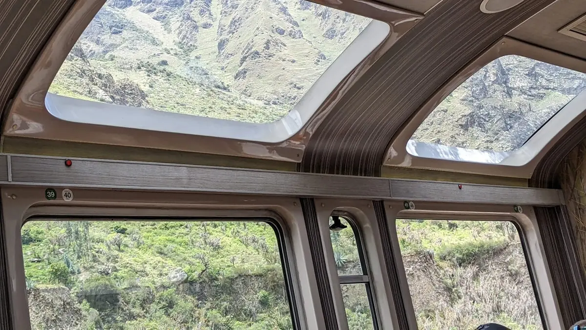 Scenic view from the train window traveling through the Sacred Valley towards Machu Picchu in Peru.