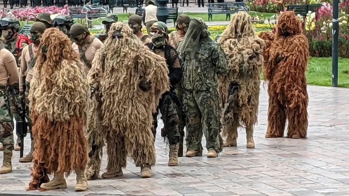 Snipers draped in full ghillie suits