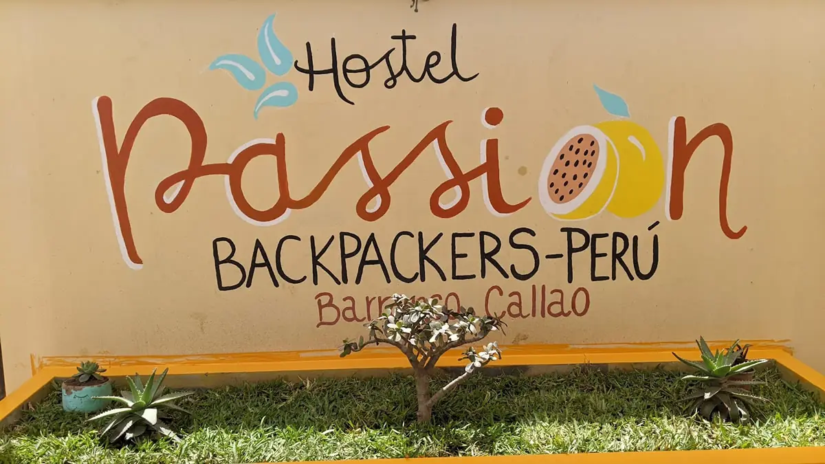 The exterior entrance of Passion Hostal, a cozy and affordable accommodation for travelers exploring the local culture of Latin America.