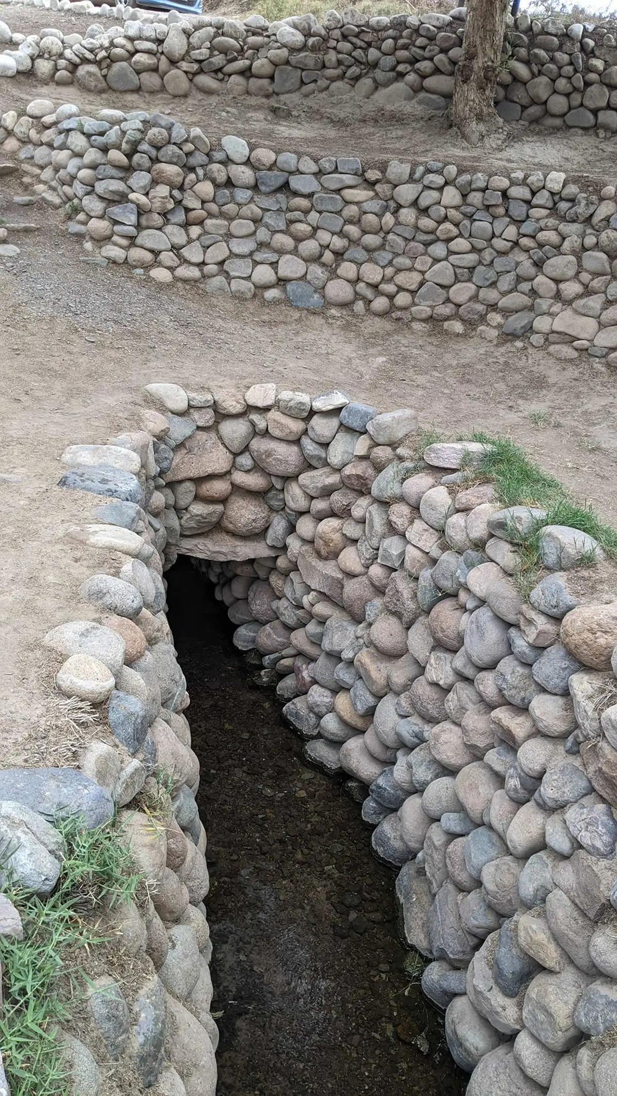 Stone-lined Cantalloc Aqueduct channel built by the Nazca civilization in Peru.